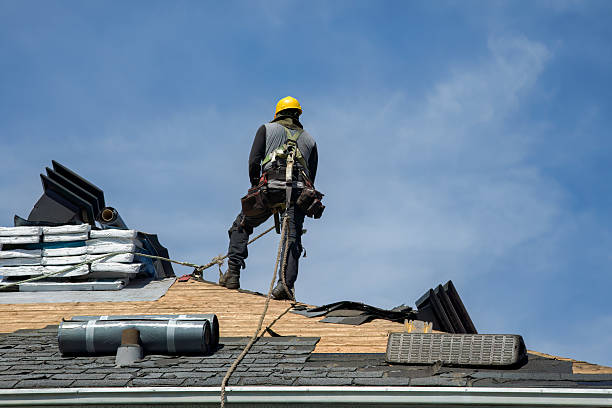 Professional Gutter Installation technician working in Brookline Village, MA
